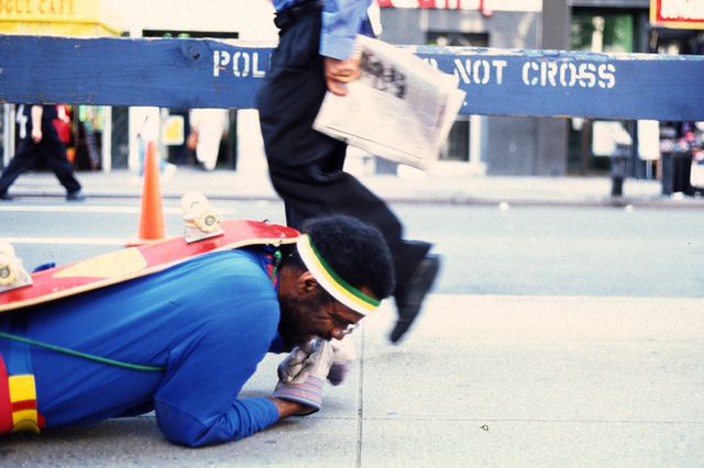 man crawling on nyc street